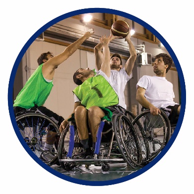 A group of people playing basketball in wheelchairs
