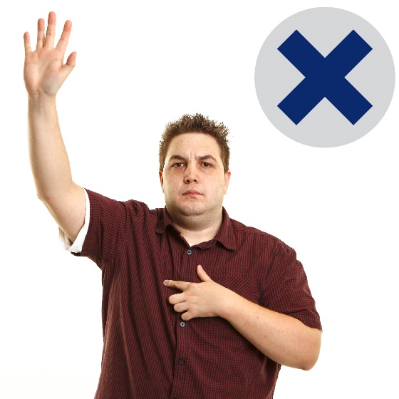 A man raising his hand to say something with a cross next to him