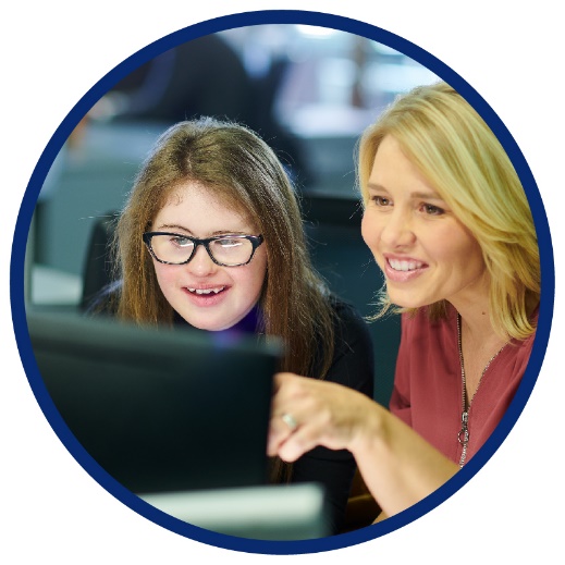 2 women using a computer together