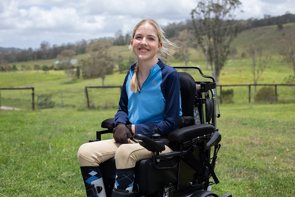 An image of Breanna on her horse outside.