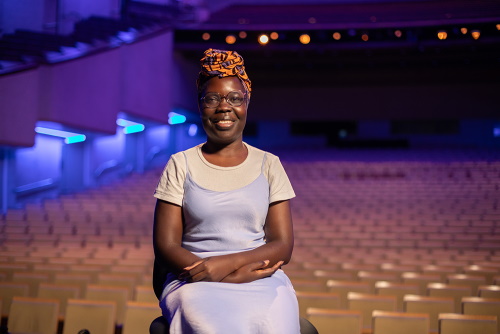 An image of Grace in a performance arts centre.