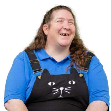 A person smiling with a cat face