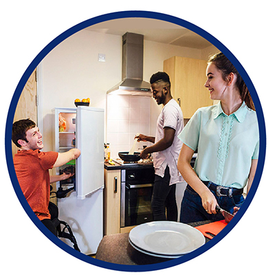 3 young people in their kitchen