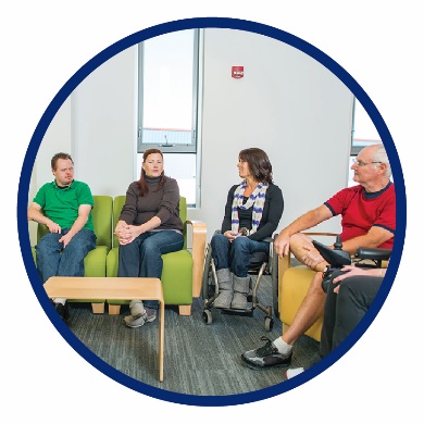 A group of people sitting in a room together