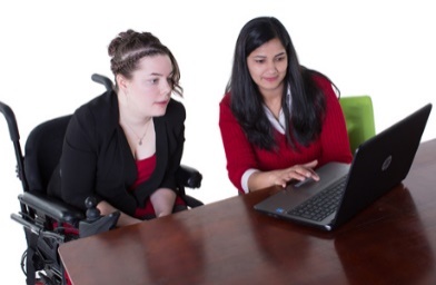 2 women looking at a computer together