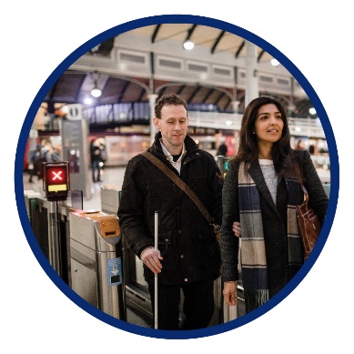 A man and a woman at a train station