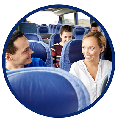 A man and a woman sitting on a bus