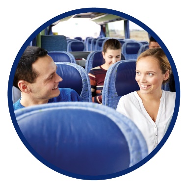 A man and a woman sitting on a bus