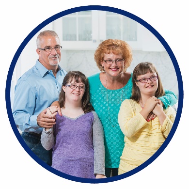 A mother, father and two daughters standing together