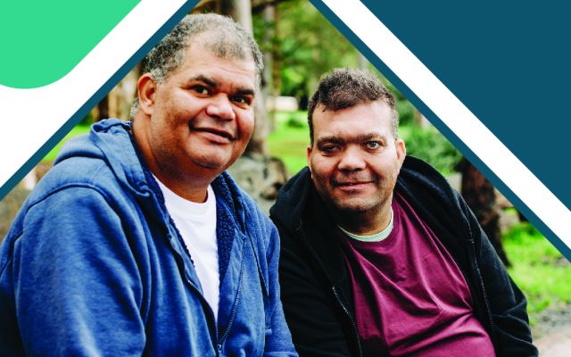 two people sitting smiling